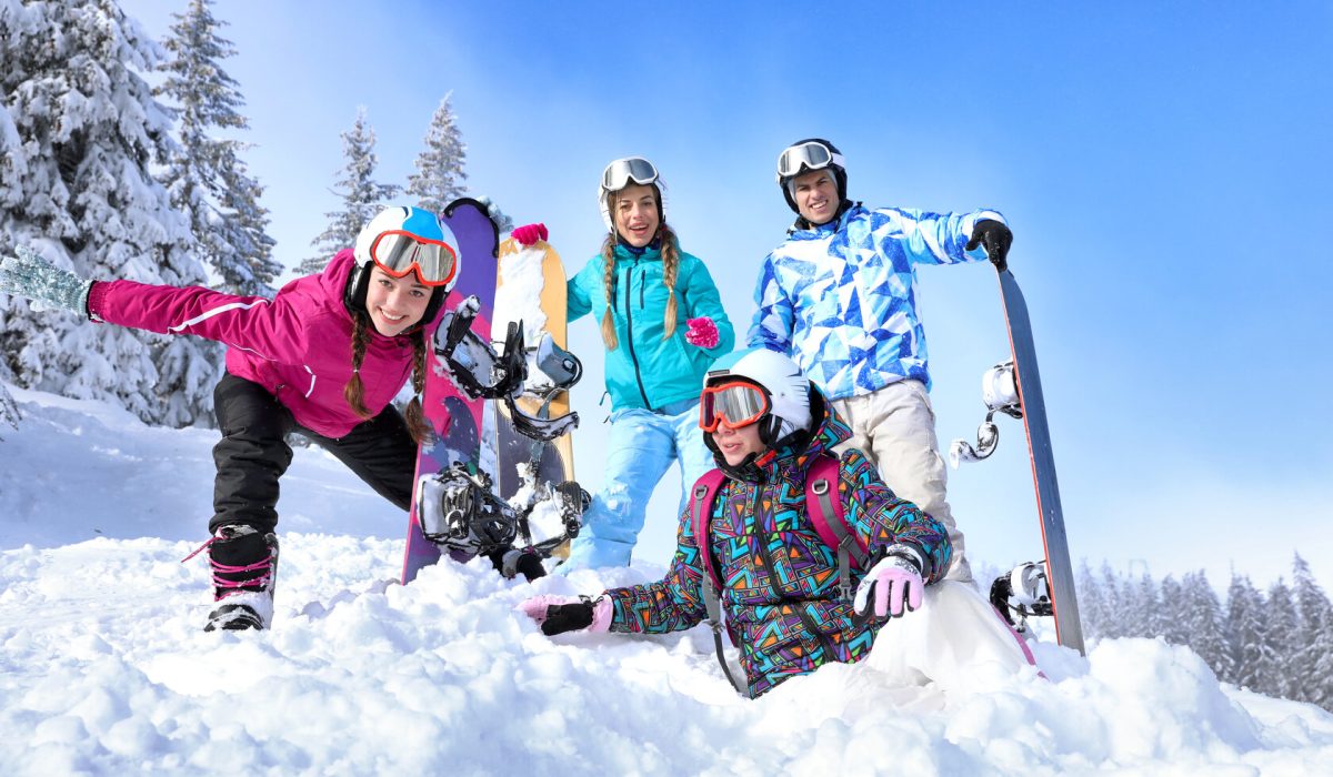 Friends at snowy ski resort. Winter vacation